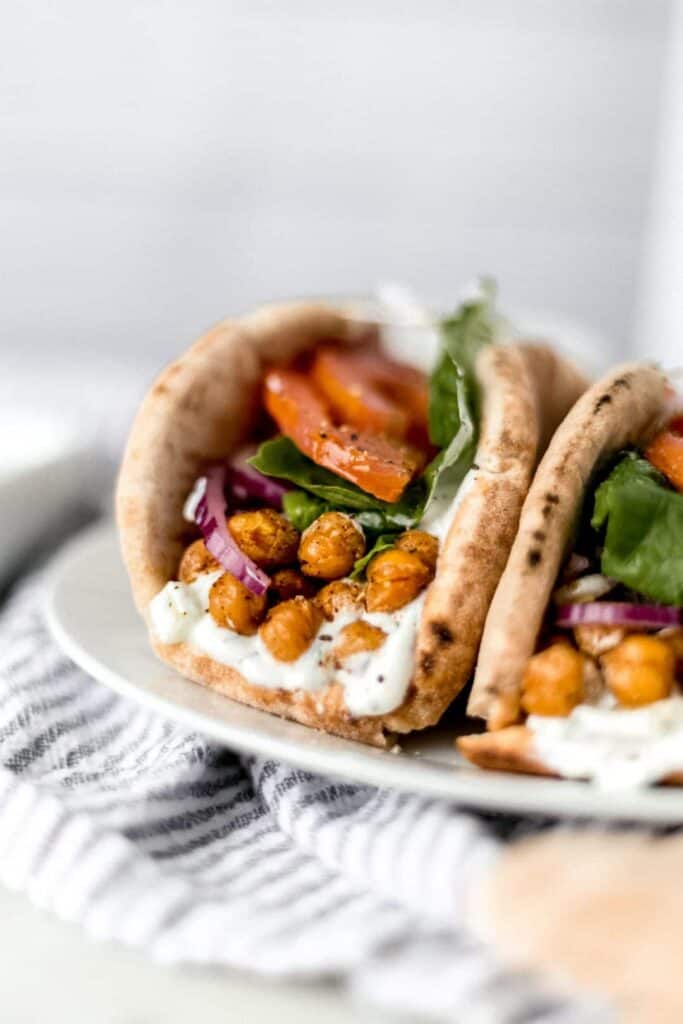 close-up side shot of spicy chickpea gyros on a plate