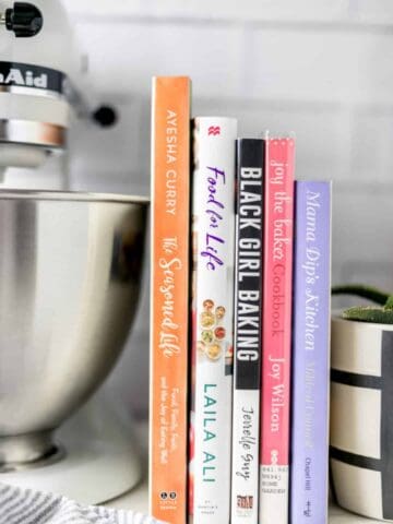 This list of 5 Cookbooks by Women of Color is sure to fit your cooking needs. From baking to healthy meals, to entertaining, these cookbooks have it all. simplylakita.com #cookbooks #blackfoodbloggers