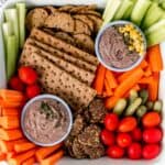 overhead view of black bean dip in a colorful vegetable platter