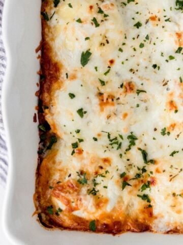 Overhead view of finished lasagna in baking dish.