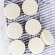 Overhead view of peanut butter cups on grate on top of cloth napkin.