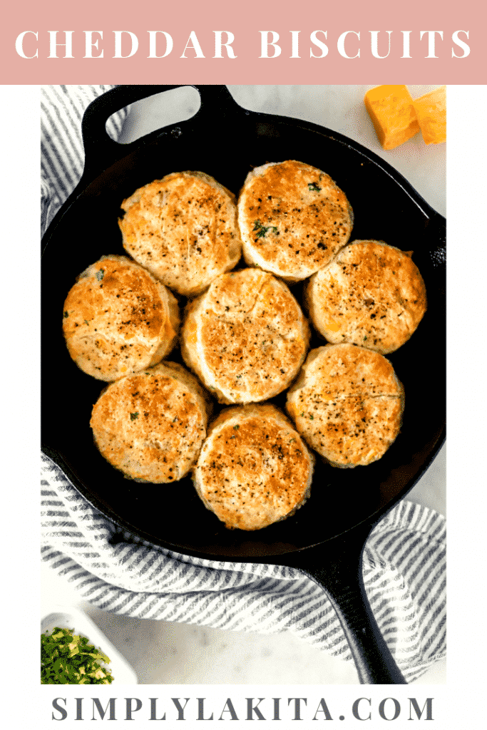 cheddar biscuits in cast iron skillet with napkin