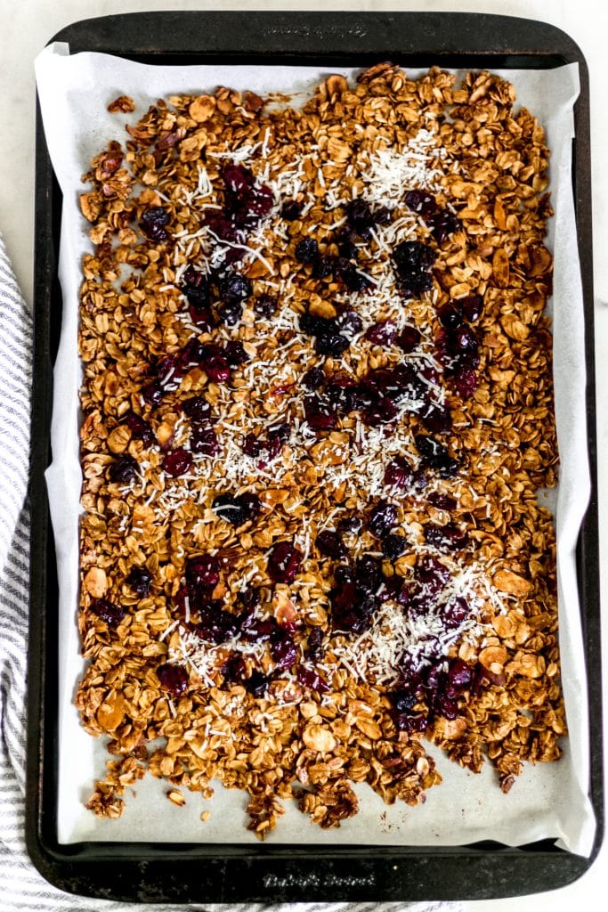 overhead view of homemade granola on a sheet pan 