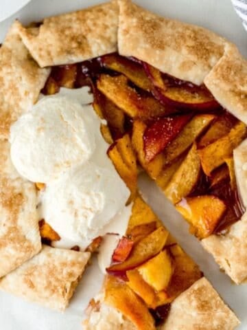 Overhead view of baked galette topped with ice cream.