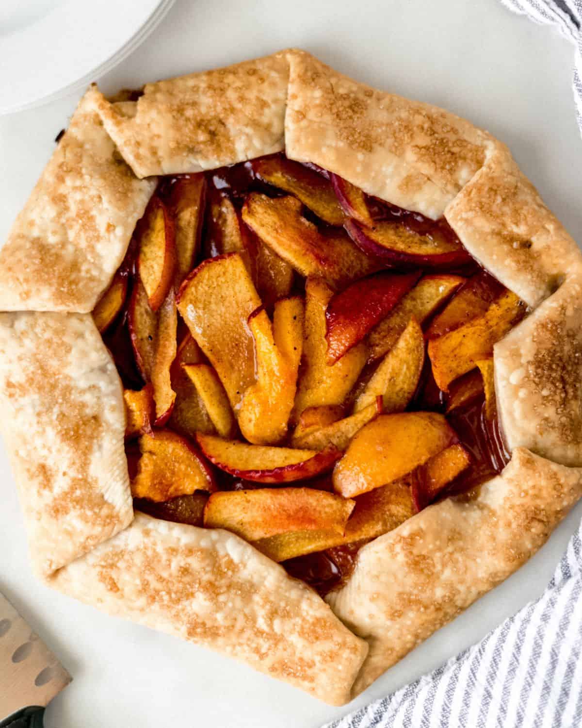 Overhead view of finished peach galette.