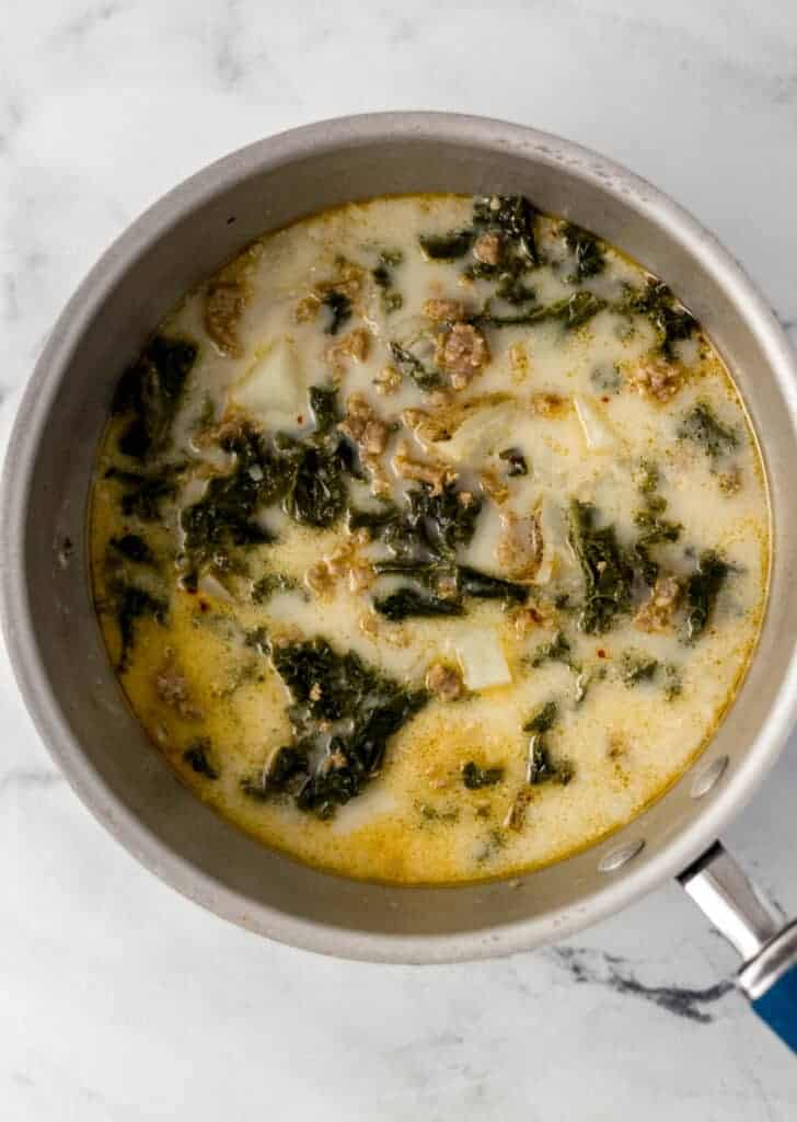 finished soup in a saucepan on a marble surface