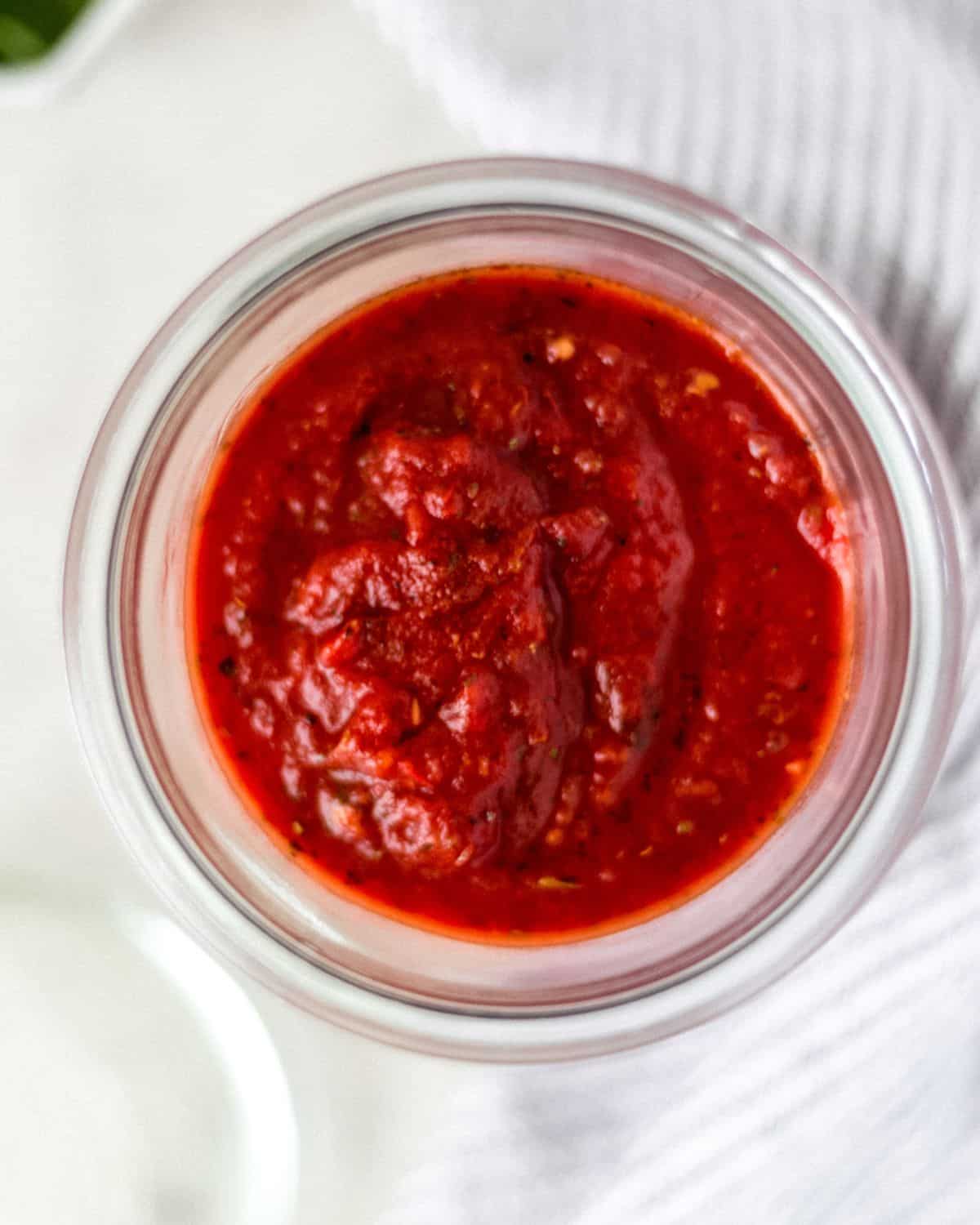 Close up view of finished sauce in a jar.