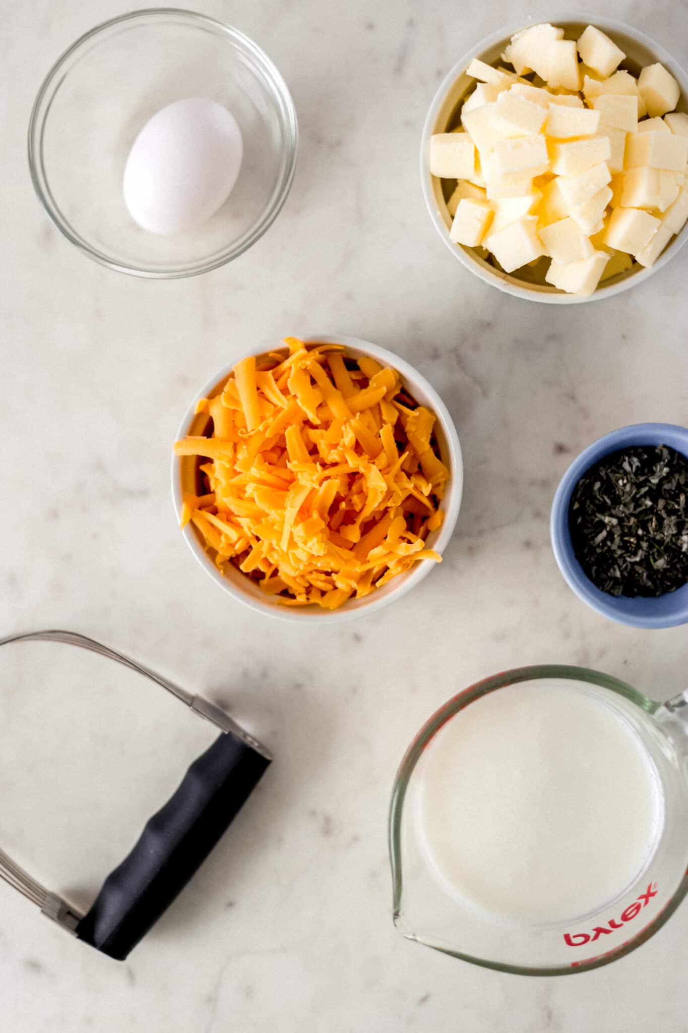 ingredients for cheddar herb biscuits on counter