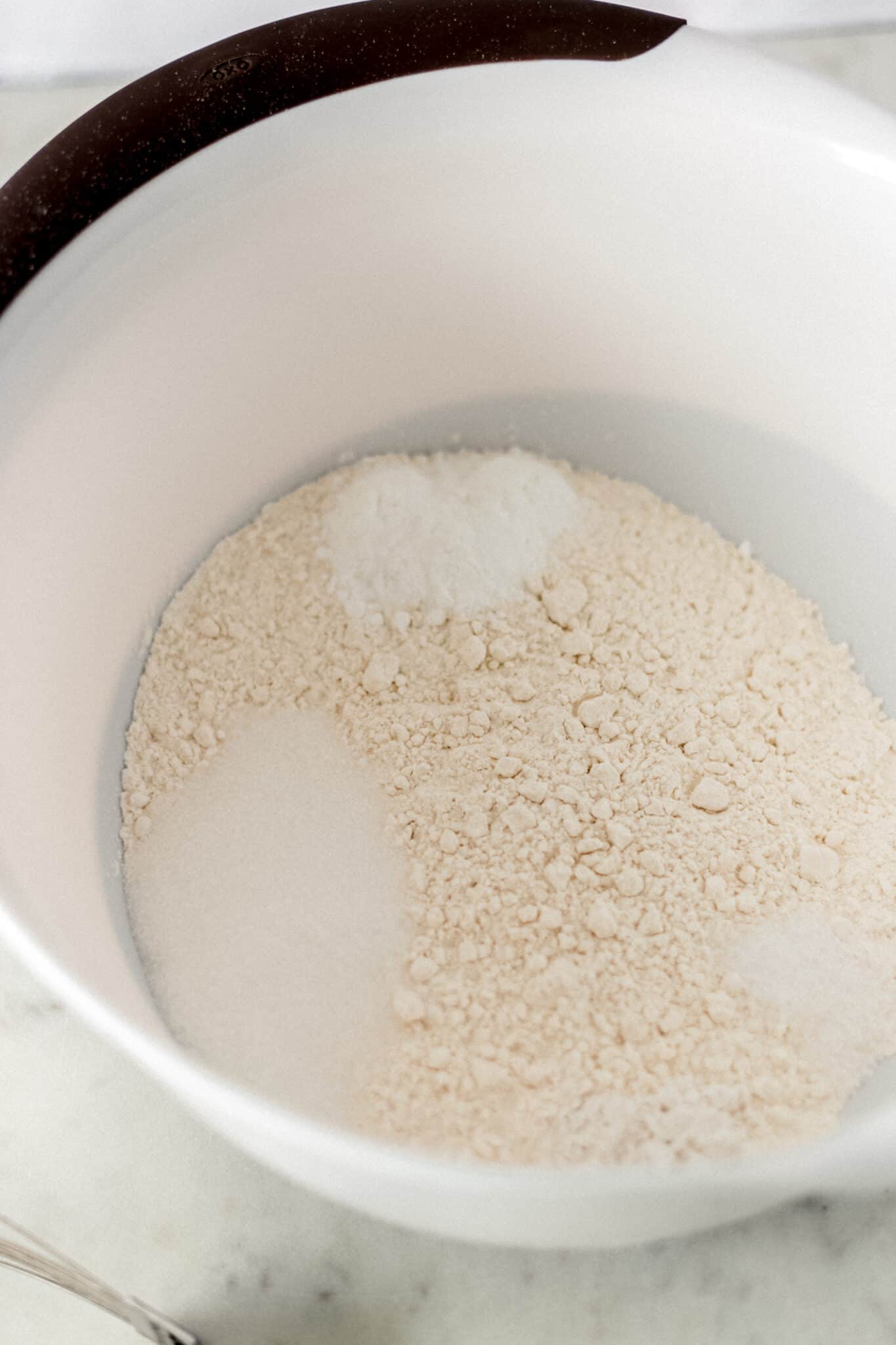 dry ingredients in large white bowl to make herb biscuits