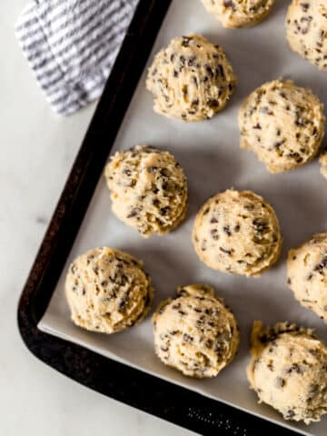 frozen cookie dough on a baking sheet