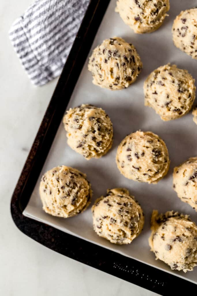 frozen cookie dough on a baking sheet 