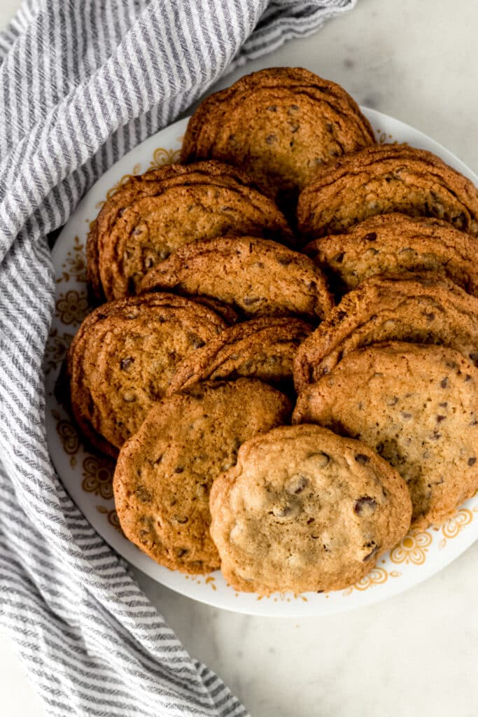 chocolate chip cookies on plate with napkin 