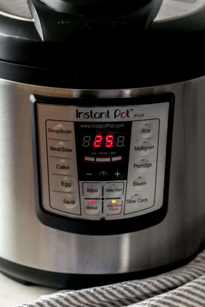 side view instant pot set on manual with 25 minutes cook time