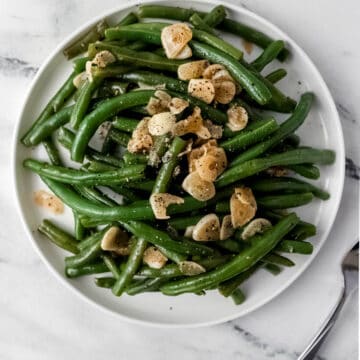 finished green beans on white dinner plate
