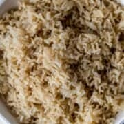 Close up view of bowl of brown rice.