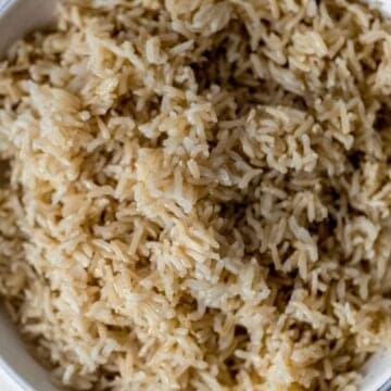 Close up view of bowl of brown rice.