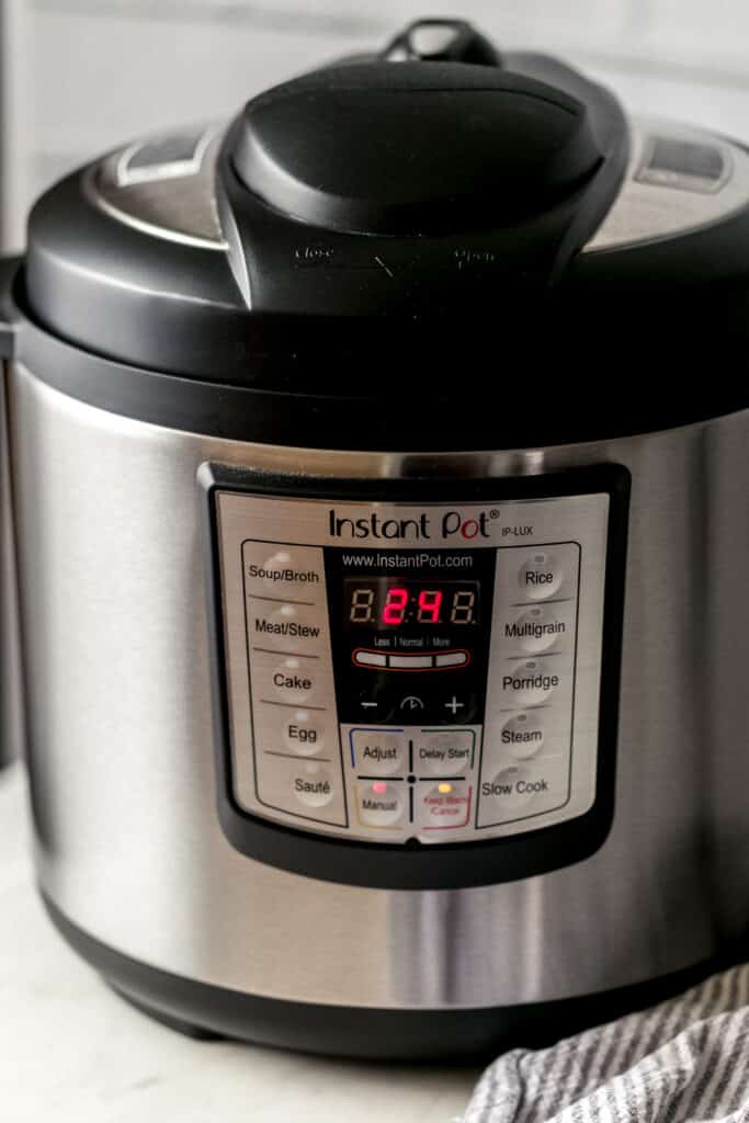 close up side view of instant pot with time set to 24