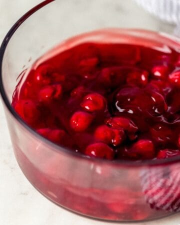 Cherry pie filling in glass baking dish.