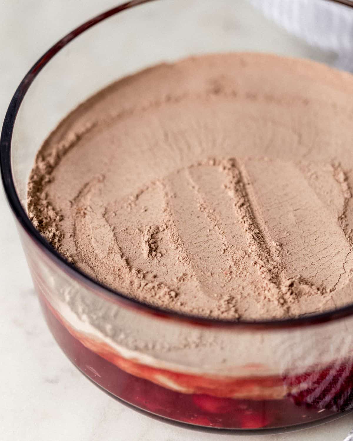 Cake mix added to pie filing in baking dish. 