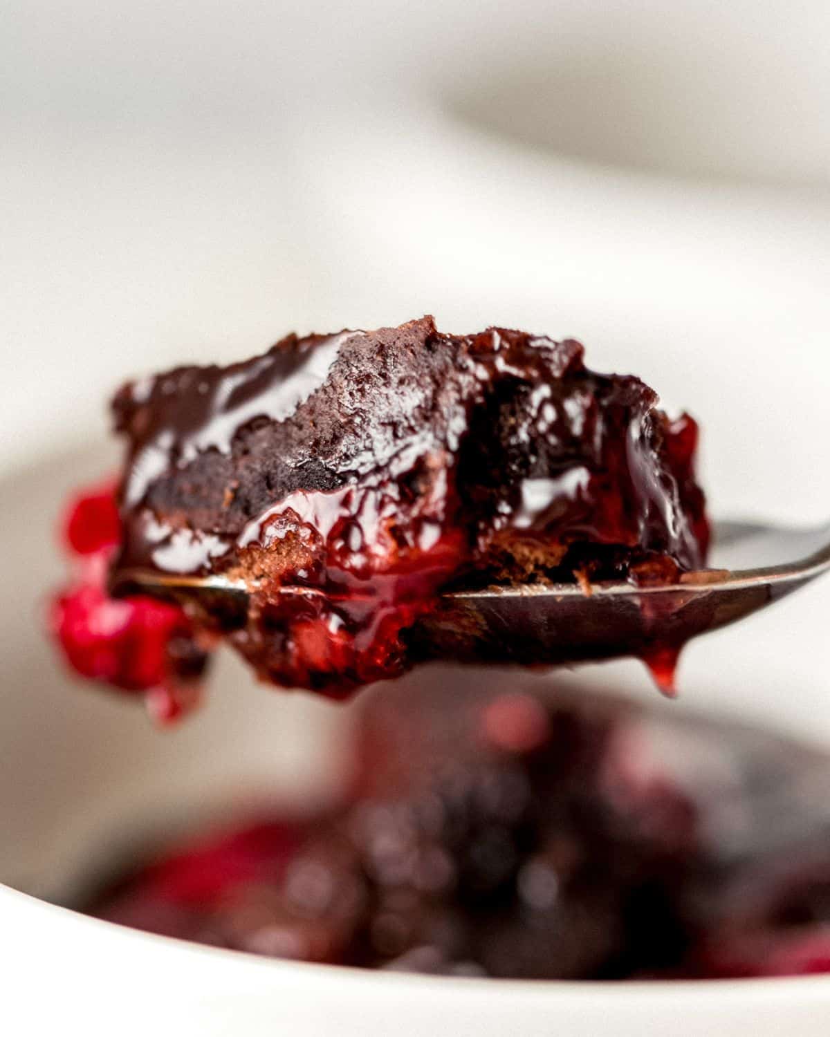 Spoon with cake on it. 