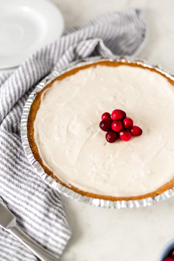 close up side view no bake eggnog cheesecake recipe with cloth napkin