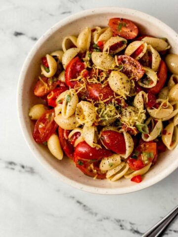 overhead view of serving of finished pasta salad in a white bowl