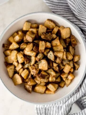Overhead view of bowl of roasted potatoes.
