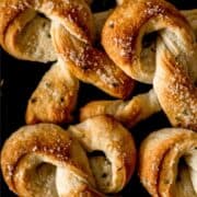 Close up view of pretzels on pin with text overlay.