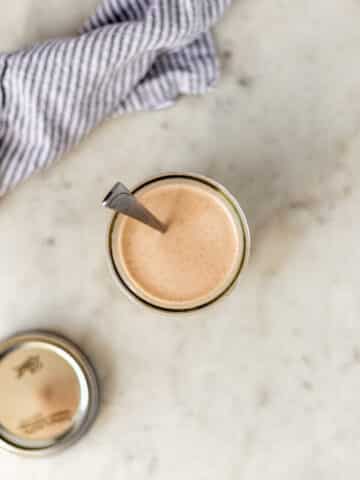 overhead view yum yum sauce in small glass jar with spoon