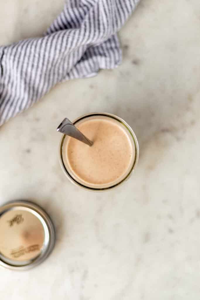 overhead view yum yum sauce in small glass jar with spoon