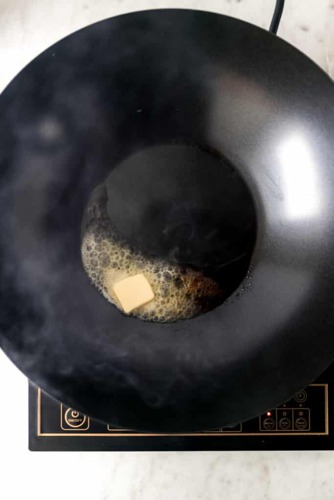 butter melting in a heated wok