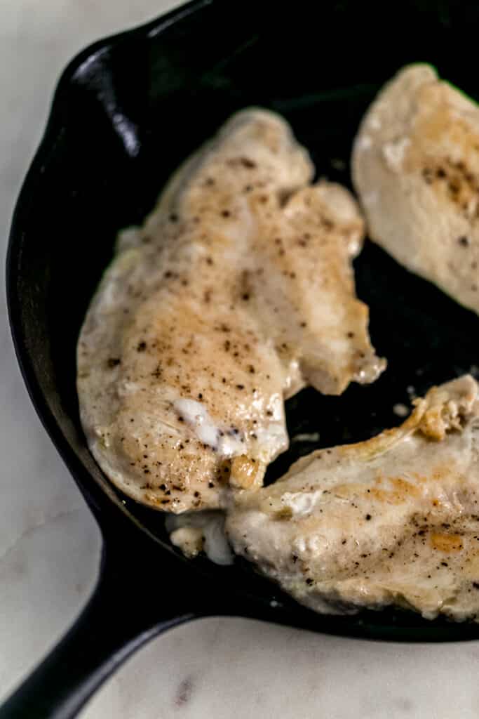 seared chicken breast in cast iron skillet 