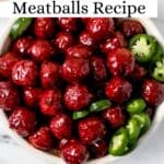 Overhead view of meatballs in a white bowl with slice jalapenos pin with text overlay.