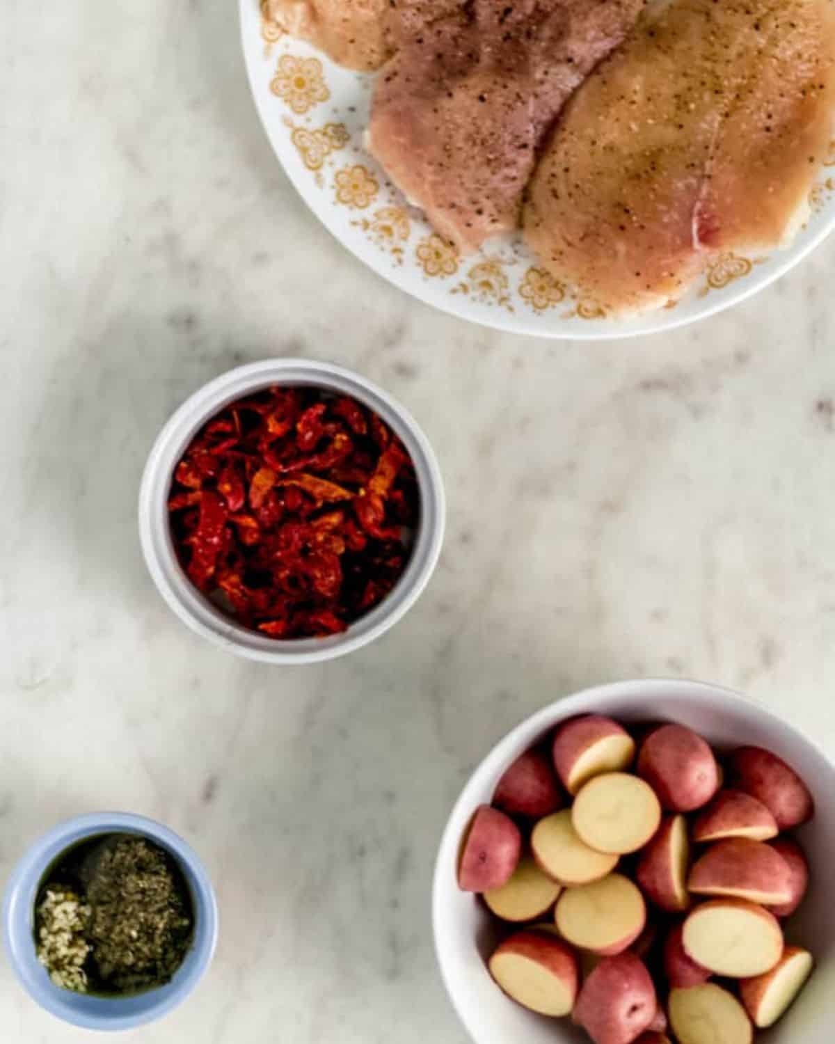Overhead view of ingredients needed to make recipe in separate bowls.