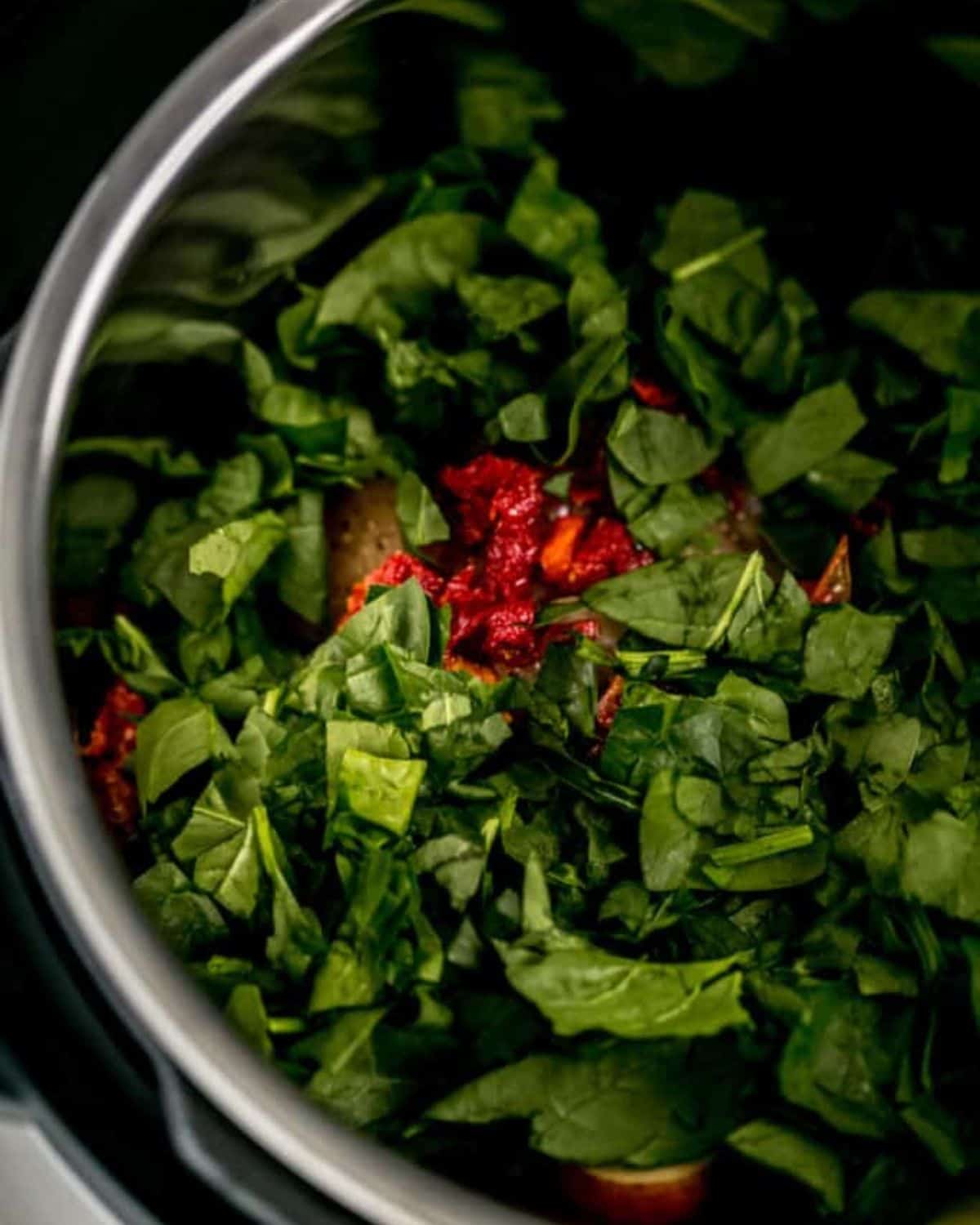 Spinach and sun dried tomatoes added to the pot with the chicken and potatoes.