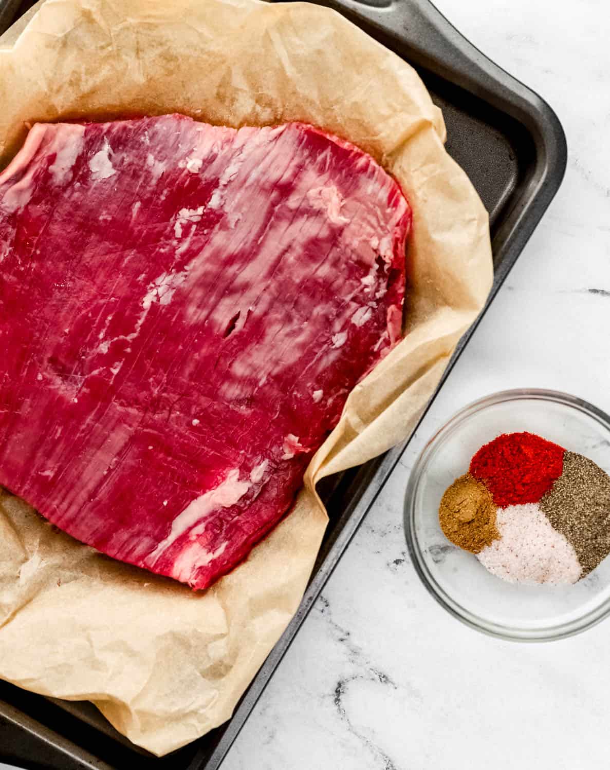 Overhead view of ingredients needed to make flank steak.