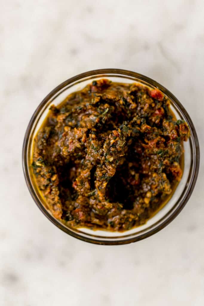 sun dried tomato pesto in small glass bowl 