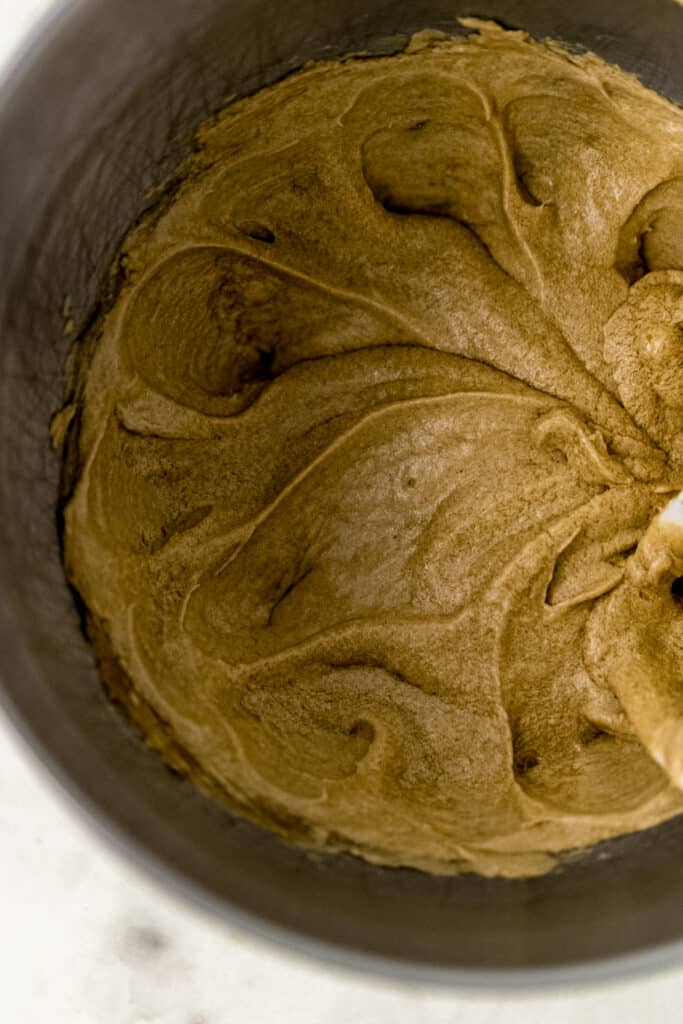 butter, brown sugar, egg, and vanilla extract combined together in stand mixer bowl 