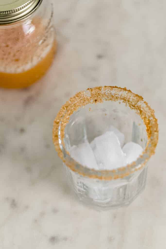 sugar rimmed glass with ice in it for margarita