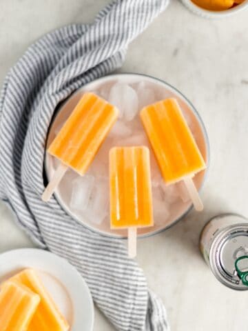 popsicles in large white bowl with ice in it