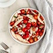Overhead view of finished salad in bowl.