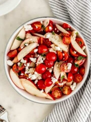 Overhead view of finished salad in bowl.