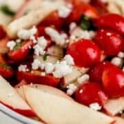 Close up view of finished salad in bowl on pin with text overlay.