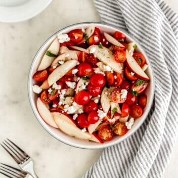 Overhead view of finished salad in a serving bowl.