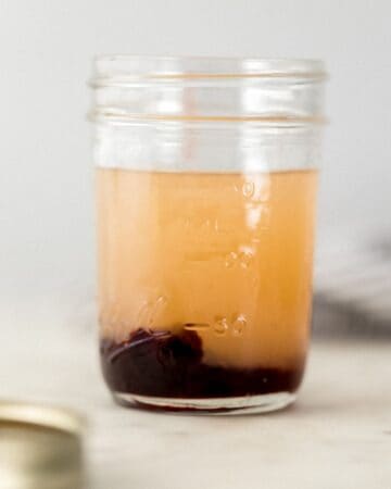Margarita ingredients added to a glass jar.