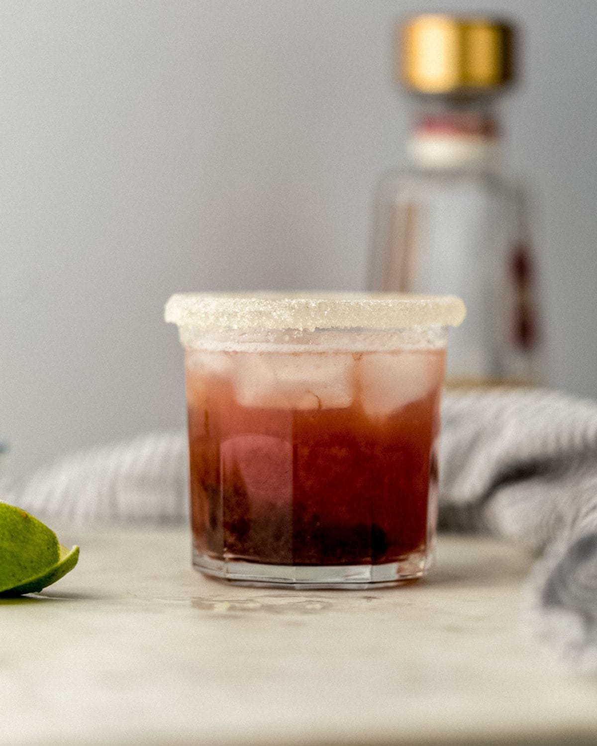 Close up side view of finished margarita in a glass. 