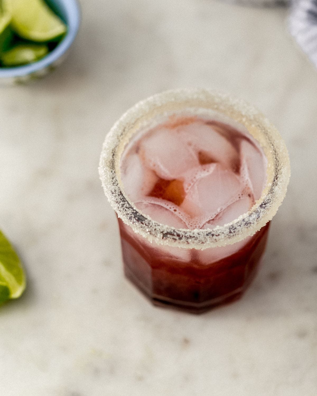 Close up view of margarita in sugar rimmed glass. 