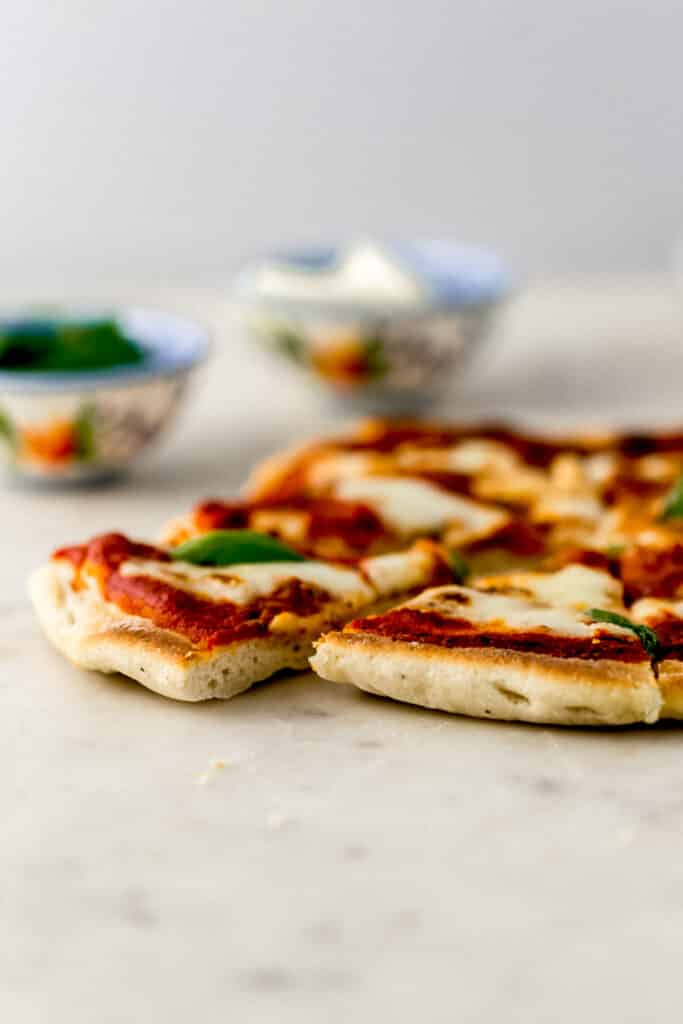 close up side view margherita pizza on marble surface 