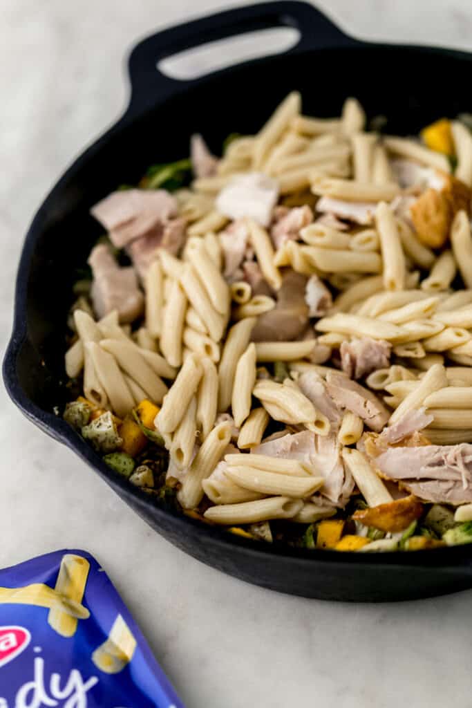 pasta ingredients combined in cast iron skillet 