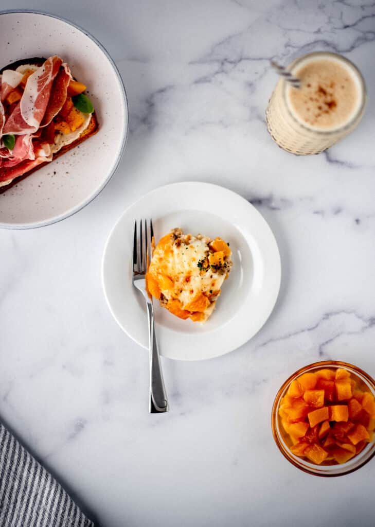 overhead view of breakfast recipes made with peaches on marble surface 